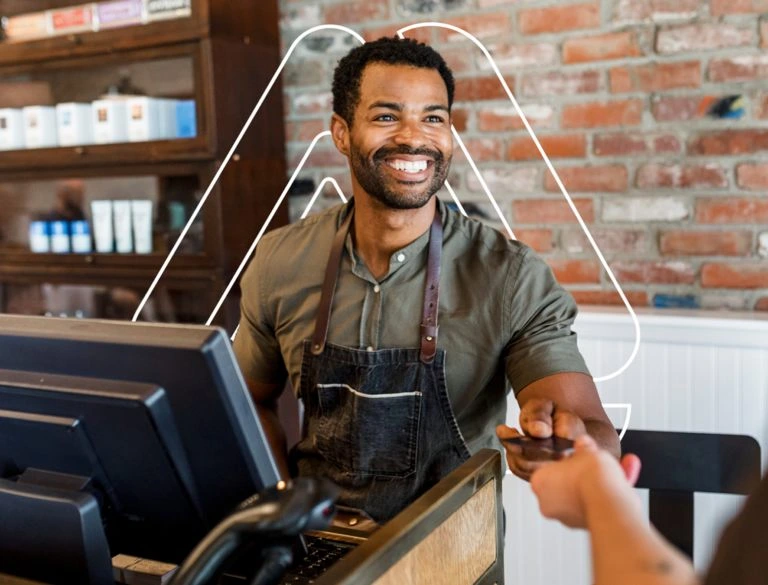 Business owner accepting a customer payment